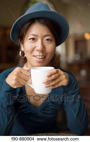 Young Japanese woman in coffeeshop View Large Photo Image Picture - Young Japanese woman in coffeeshop. Fotosearch