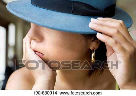 Picture - Young Japanese woman in coffeeshop. Fotosearch