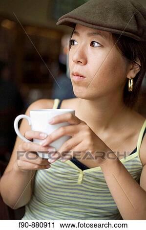 Young Japanese woman in coffeeshop View Large Photo Image Stock Image - Young Japanese woman in coffeeshop. Fotosearch