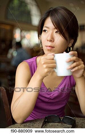 Young Japanese woman in coffeeshop View Large Photo Image Stock Photo - Young Japanese woman in coffeeshop. Fotosearch