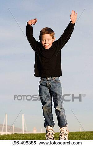 young jumping boy View Large Photo Image Stock Photography - young jumping boy. Fotosearch