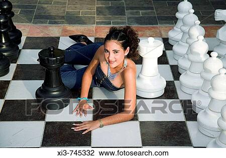 Young lady posing on a large outdoor chessboard, near Trinidad, Cuba View Large Photo Image Stock Image - Young lady posing on a large outdoor chessboard, near Trinidad, Cuba. Fotosearch