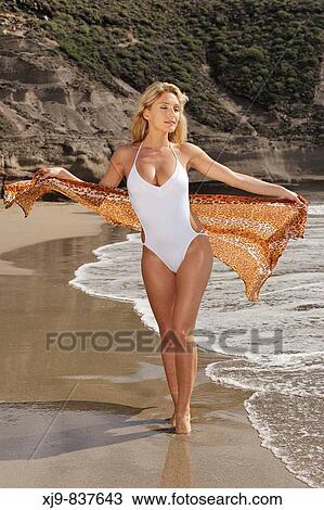 Young lady walk on the beach in Tenerife south. View Large Photo Image Stock Image - Young lady walk on the beach in Tenerife south.. Fotosearch