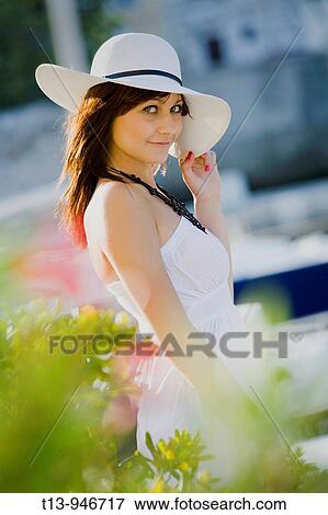 Young lady with White hat is fancying View Large Photo Image Stock Photo - Young lady with White hat is fancying. Fotosearch