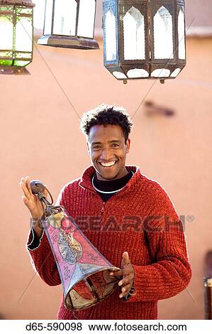 Young Lamp Seller. Ensemble Artisanat. Ouarzazate. South of the High Atlas. Morocco View Large Photo Image Stock Photo - Young Lamp Seller. Ensemble Artisanat. Ouarzazate. South of the High Atlas. Morocco. Fotosearch