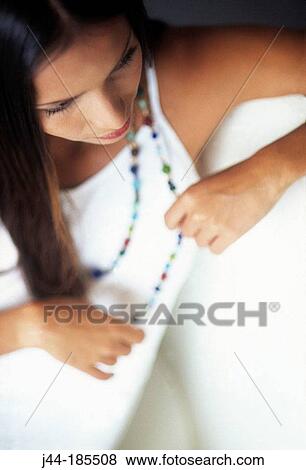 Young Latin woman with necklace View Large Photo Image Stock Photo - Young Latin woman with necklace. Fotosearch