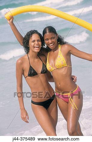 Young latin women at the beach View Large Photo Image Stock Photo - Young latin women at the beach. Fotosearch