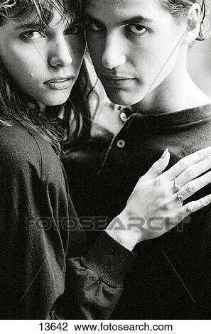 Stock Image - Young love in the rain. Fotosearch