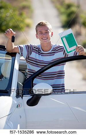 Young male learner driver View Large Photo Image Stock Photograph - Young male learner driver. Fotosearch