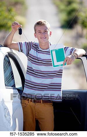 Young male learner driver View Large Photo Image Stock Photography - Young male learner driver. Fotosearch
