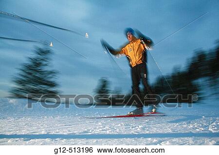 Young man, age 13, nordic skiing at night. View Large Photo Image Stock Photograph - Young man, age 13, nordic skiing at night.. Fotosearch