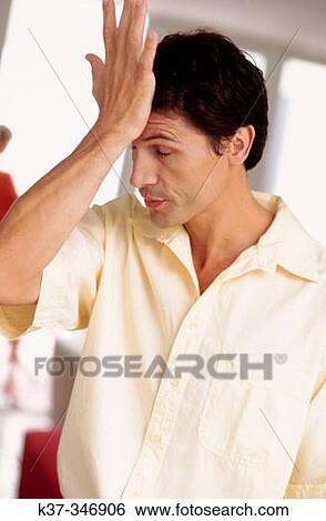 Young man annoyed about not seeing the obvious View Large Photo Image Stock Photograph - Young man annoyed about not seeing the obvious. Fotosearch
