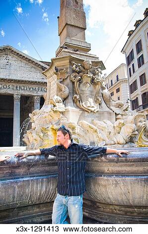 Young man at fountain in Rome, Italy View Large Photo Image Stock Image - Young man at fountain in Rome, Italy. Fotosearch