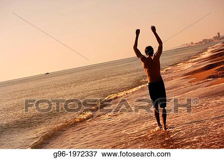 Young man at the Saler beach, Valencia, Spain View Large Photo Image Stock Photo - Young man at the Saler beach, Valencia, Spain. Fotosearch
