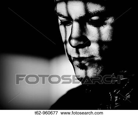 Young man behind bars Black and white Conceptual View Large Photo Image Stock Photo - Young man behind bars Black and white Conceptual. Fotosearch