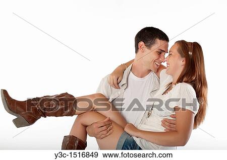 Stock Photo - Young man carrying his woman. Fotosearch