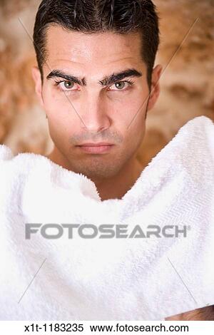 Young man drying his face. View Large Photo Image Stock Photography - Young man drying his face.. Fotosearch
