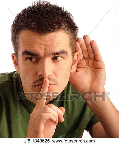 Young man eavesdropping View Large Photo Image Stock Photography - Young man eavesdropping. Fotosearch