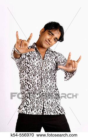 Young man in a dance pose. View Large Photo Image Stock Image - Young man in a dance pose.. Fotosearch