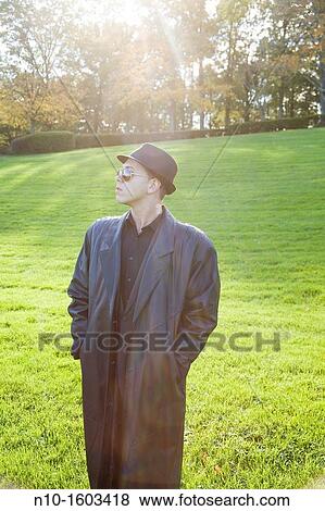 Young man in a park View Large Photo Image Stock Photo - Young man in a park. Fotosearch