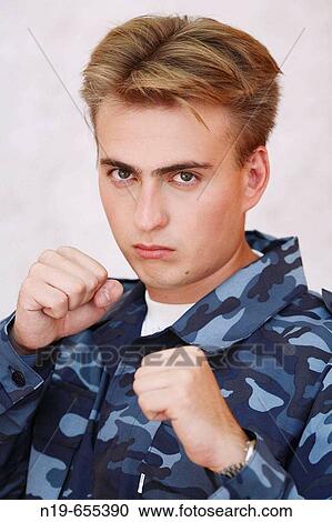Young man in military security uniform View Large Photo Image Stock Image - Young man in military security uniform. Fotosearch