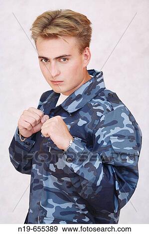 Young man in military security uniform View Large Photo Image Stock Photo - Young man in military security uniform. Fotosearch