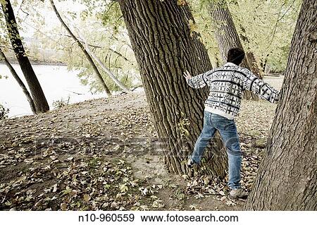 Young man in the woods View Large Photo Image Stock Photo - Young man in the woods. Fotosearch