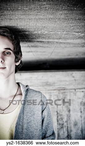 Stock Photograph - Young man in urban setting. Fotosearch