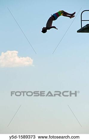 young man jumping from the jumping tower to water, beach on the Geneva Lake in Geneva called? Paquis plage?, Geneva, Switzerland View Large Photo Image Stock Image - young man jumping from the jumping tower to water, beach on the Geneva Lake in Geneva called? Paquis plage?, Geneva, Switzerland. Fotosearch