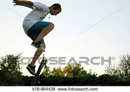 Young man jumping with a skateboard at Letna Park, Prague, Czech Republic View Large Photo Image Stock Photo - Young man jumping with a skateboard at Letna Park, Prague, Czech Republic. Fotosearch