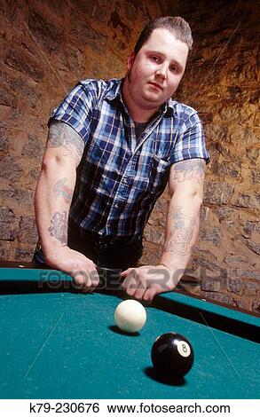 Young man leaning on pool table. View Large Photo Image Stock Photograph - Young man leaning on pool table.. Fotosearch