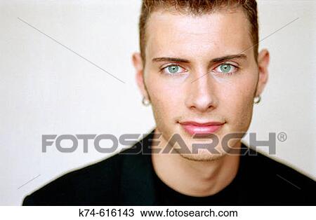 Stock Image - Young Man Looking At Camera. Fotosearch