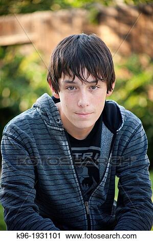 young man looking at the camera View Large Photo Image Stock Image - young man looking at the camera. Fotosearch