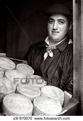 Young man making cheese Ochagavia Navarra Spain View Large Photo Image Stock Image - Young man making cheese Ochagavia Navarra Spain. Fotosearch