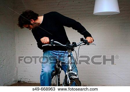Young man on bicycle View Large Photo Image Stock Image - Young man on bicycle. Fotosearch