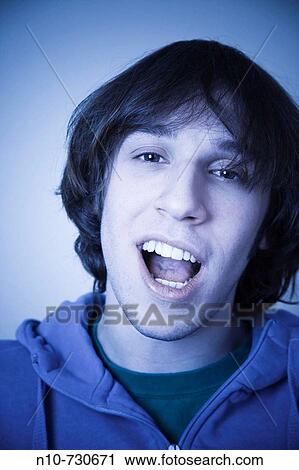 Stock Image - Young man posing.. Fotosearch