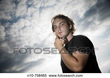 Stock Photography - Young man posing.. Fotosearch