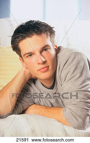 Stock Image - Young Man, relaxing. Fotosearch