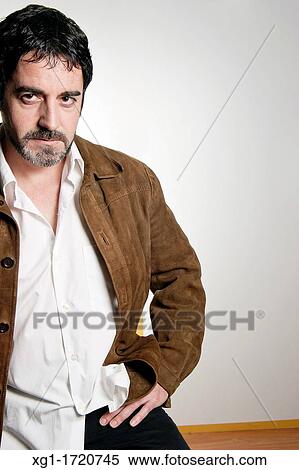 Stock Photography - Young man seriously. Fotosearch