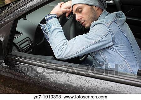 Young Man Sleeping at Wheel in Car View Large Photo Image Stock Photo - Young Man Sleeping at Wheel in Car. Fotosearch