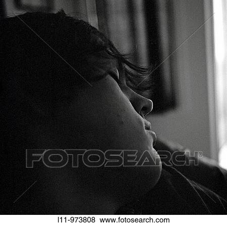 Young man sleeping in living room. View Large Photo Image Stock Photo - Young man sleeping in living room.. Fotosearch