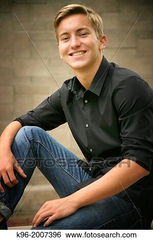 young man smiling at camera View Large Photo Image Stock Photograph - young man smiling at camera. Fotosearch
