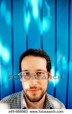Stock Image - Young man smiling. Fotosearch
