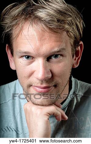 Stock Image - Young man smiling. Fotosearch