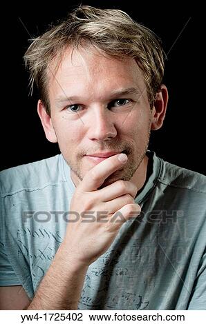Stock Image - Young man smiling. Fotosearch