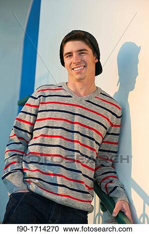 Stock Image - Young man-stairs. Fotosearch