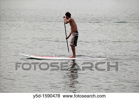 young man surfing, Geneva Lake, Switzerland View Large Photo Image Stock Photo - young man surfing, Geneva Lake, Switzerland. Fotosearch