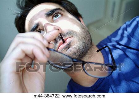Stock Image - Young man thinking.. Fotosearch
