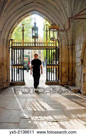 Young man walking through one of Westminster Abbey side gates. View Large Photo Image Stock Image - Young man walking through one of Westminster Abbey side gates.. Fotosearch