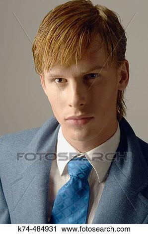 young man wearing a suit and tie View Large Photo Image Stock Image - young man wearing a suit and tie. Fotosearch
